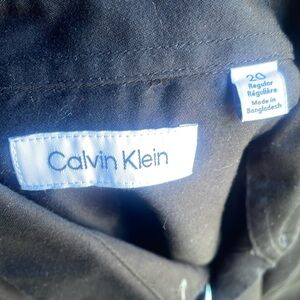 Calvin Klein boys size 20, black button-down collared shirt.